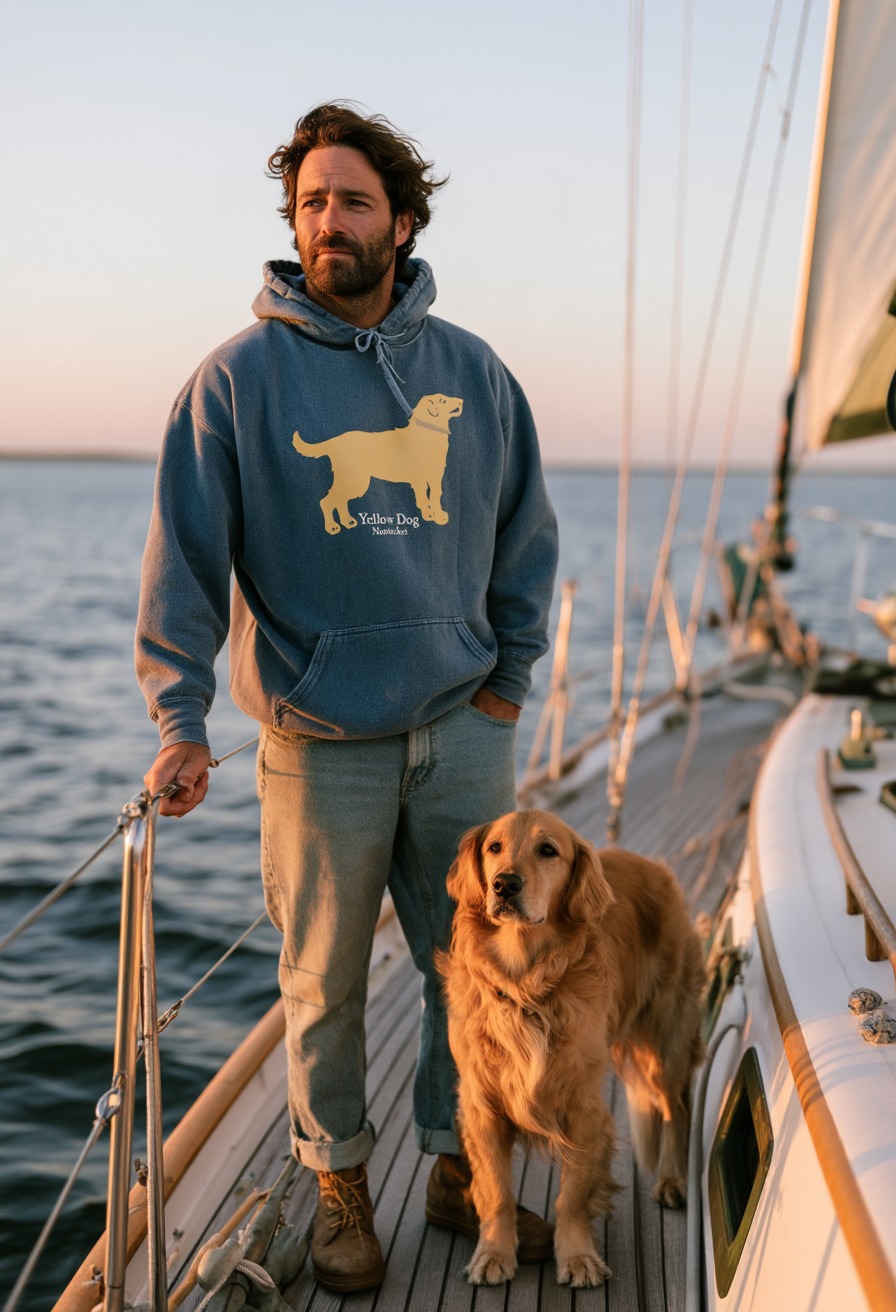 Man on a sailboat off Nantucket wearing a Washed Denim Blue Yellow Dog pullover hooded sweatshirt